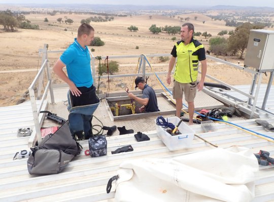 TAG Dive team co ordinating installation of FRP post bases into water reservoir | TAG Diving