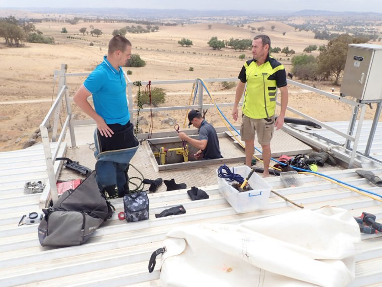 TAG Dive team co ordinating installation of FRP post bases into water reservoir | TAG Diving